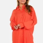 Losvallende blouse met knopen oranje